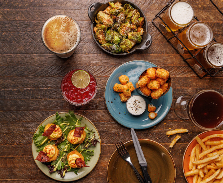 Assorted food and drinks on a wooden table