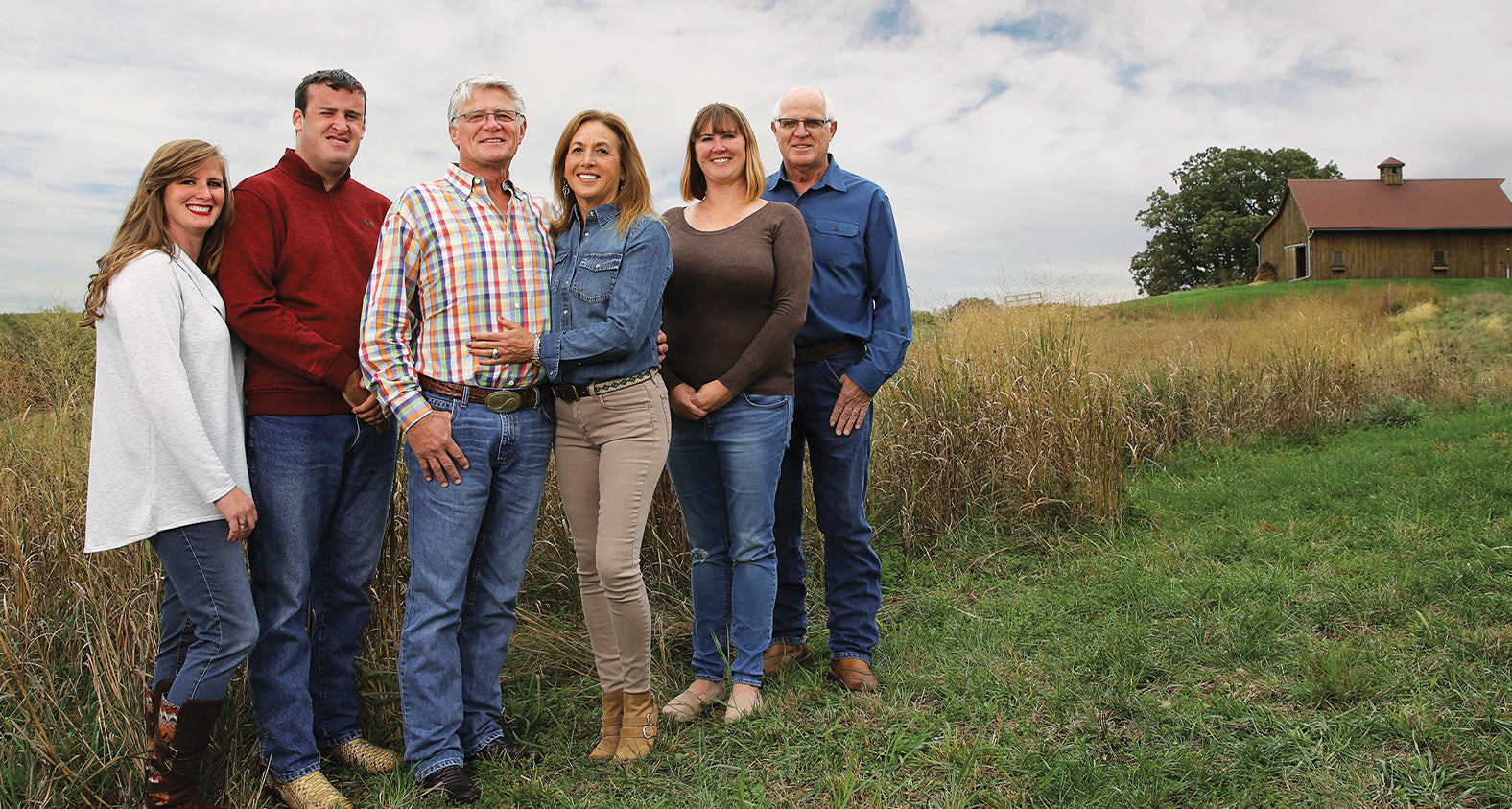 Tim Beeler posing with family on farm alt tag