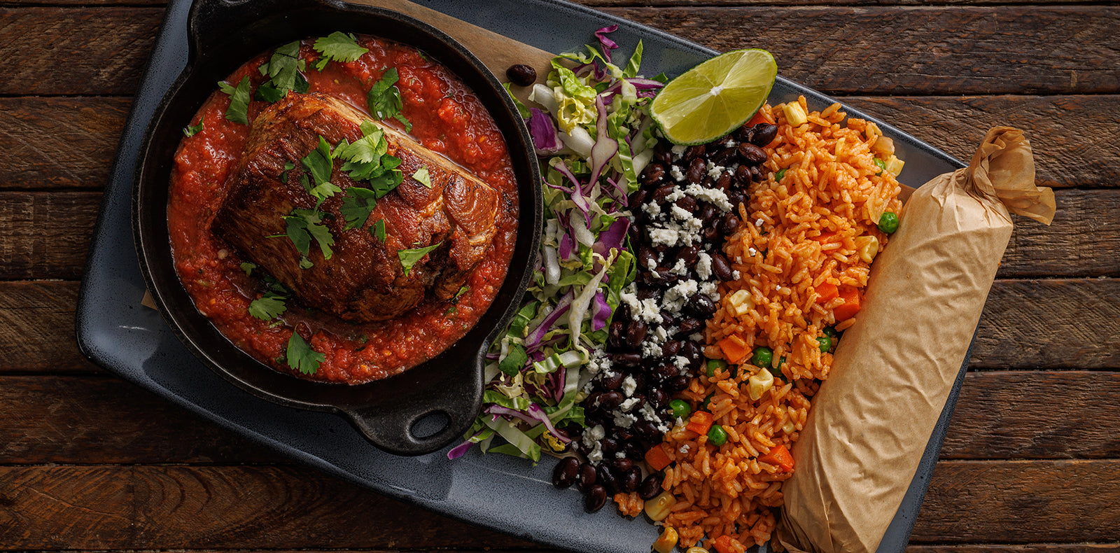 Citrus + garlic marinade, roasted salsa, cabbage, black beans, Spanish rice & tortillas