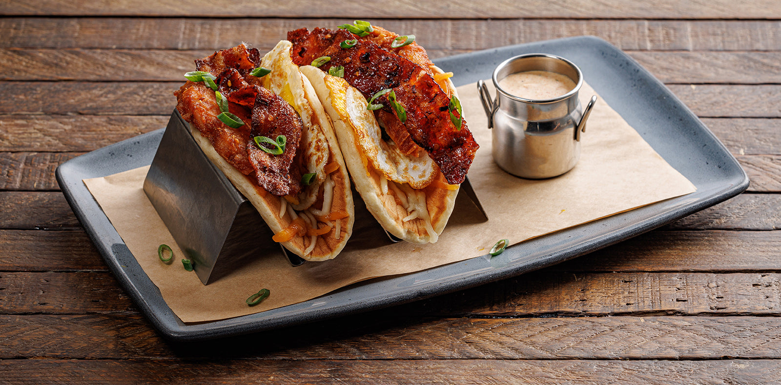 Bacon eggs jack/cheddar cheese hash browns green onions wrapped in buttermilk pancakes