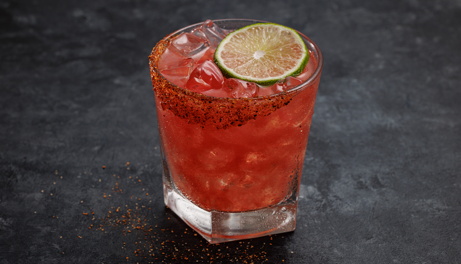 Watermelon Margarita with a lime wedge